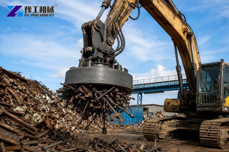 Close-Up Of Hydraulic Excavator Magnet And Hose Connections Above Scrap Metal