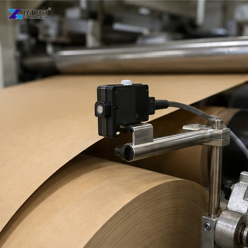 Dust extraction hood beside kraft paper slitting knives