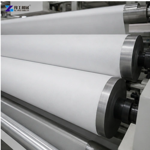 Technician inspecting clean edge of slit nonwoven roll