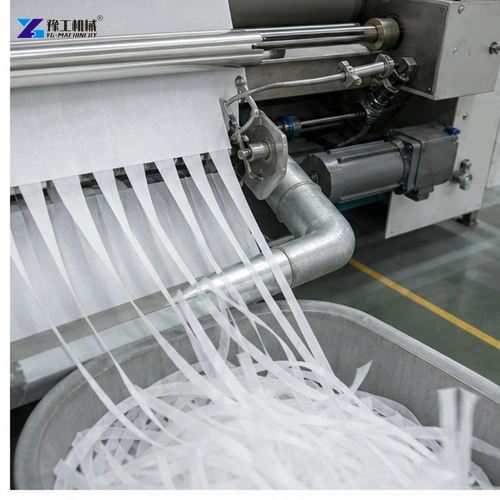 Operator setting cores during nonwoven slitter changeover