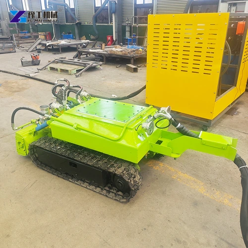 Green tracked dredging unit with control cabinet in the workshop