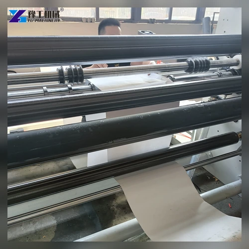 Paper web aligned across the slitting machine roller path