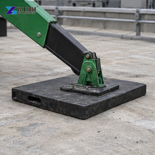 Spider crane outrigger foot on a roof mat