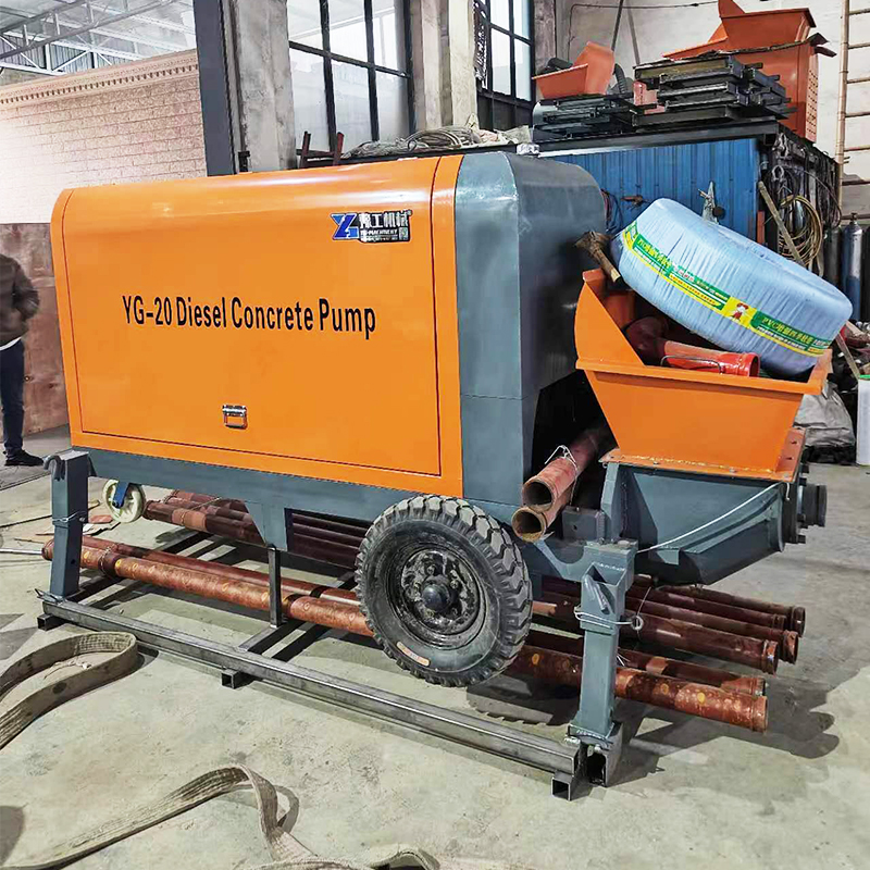 YG-20 diesel concrete pump with receiving hopper and delivery pipes in the factory