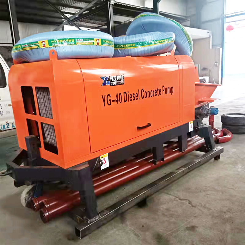 YG-40 diesel concrete pump with factory delivery pipes beside the chassis