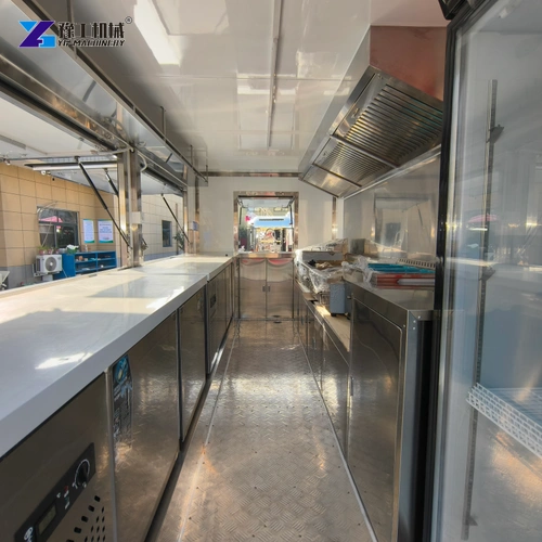 Food Trailer Interior With Stainless Worktops And A Central Aisle