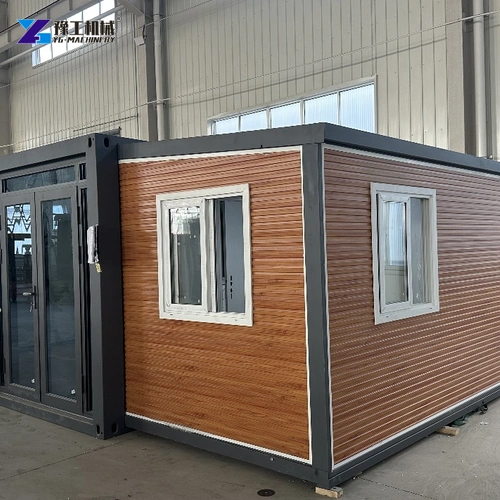 Brown Exterior Panels And Dark Window Trim On An Expandable House