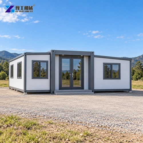 Expanded white prefab building positioned on a clear prepared plot