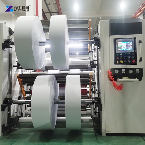 Slitter rewinder with wide film rolls beside its operator control cabinet