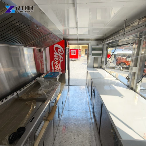 Interior counter running beside the open serving windows of a catering trailer