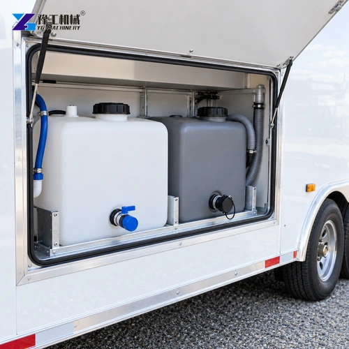 Separate closed water tanks placed in a catering trailer utility bay