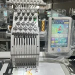 Compact embroidery machine working head and adjacent controls